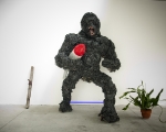 Gino Blanc, Kong plastic evolution, 2012, scultura con missile, polietine, ferro, CA2CO3, legno, bitume, colore ad olio, glitter, vetro, marmo, lingua mozzata, pianta in vaso, 230x120x110 cm., foto Giacomo De Dona